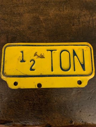 Vintage 1/2 Ton Metal Embossed License Plate Topper Sign