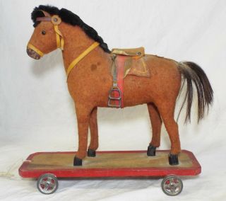 Antique German 10 3/4 " Wood & Cloth Horse On Wheels Pull Toy Horse W/ Saddle
