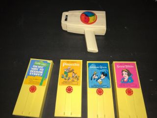 Vintage Fisher Price Movie Viewer W/ 4 Movie Cartridges,  Disney & Sesame Street