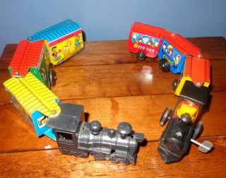 2 Vintage Tin Toy Trains Wind Up Zig - Zag Comic Express & Marx Disneyland Express