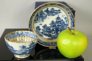 A Chinese Qianlong Period (1735 - 1796) Blue & White Gilt Decorated Cup & Saucer