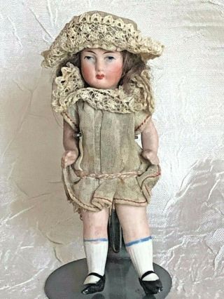 Dressed.  Antique German All Bisque Doll 3 7/8 "
