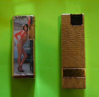 2 - Vintage Butane Cigarette Lighters - Made In Korea - One With Pinup Pics.
