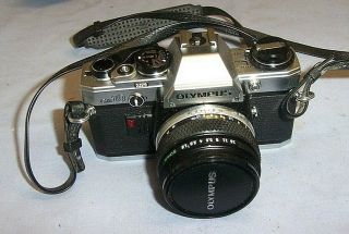 Vintage Olympus Om10 Slr 35mm Camera Complete With Case & Carry Strap.