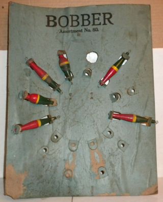 Very Old Store Display With 6 Wooden Fishing Bobbers On The Board Easel Back