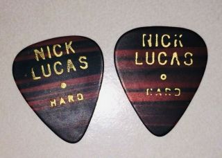 2 (two) Vintage Hard Nick Lucas Faux Woodgrain Guitar Picks