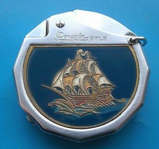 Penguin “smile” Vintage Lighter With Brass & Enamelled Sailing Ship Design Front