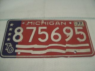 1976 Michigan License Plate,  Bi - Centennial Red White And Blue.  With 1977 Renewal