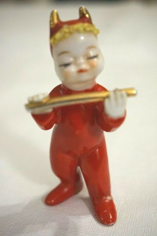 Vintage Japan Ceramic Red Devil Baby Holding Flute Baton - Mended