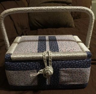 Vintage Blue Floral Fabric Sewing Box With Swing Handle And Cord Closure.