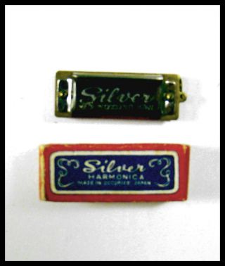 For The Serious Collector A Vintage Mini " Silver " Harmonica.