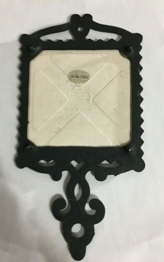 VIntage cast iron trivet with square tile advertising Orleans,  Louisiana 3