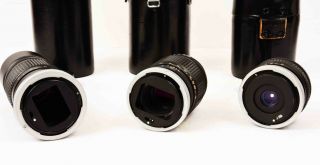 Three Vintage Canon FL Lenses,  135mm f:3.  5,  35mm f:3.  5,  200mm f:4.  5 with Cases 3