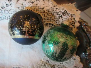 2 Vintage Glass Christmas Ornaments Blue & Green Stencils Santa Flying Over City