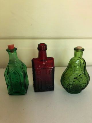 3 Vintage Miniature Red/green 3”tall Embossed Glass Bottles.  Whiskey,  Apothecary