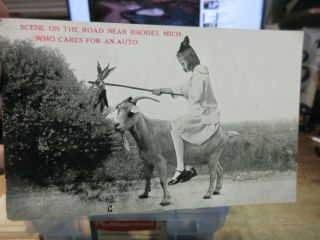 Vintage Old Postcard Michigan Rhodes Girl Riding On A Goat Who Cares For An Auto