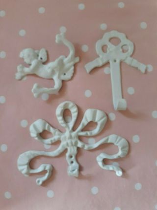 Vintage Shabby Chippy Painted Solid Brass Set Of 3 Bow And Cherub Wall Hooks