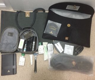 Emirates First Class Kit.  Bag,  Pjs (medium),  Bvlgari Toiletries,  Book,  Slippers
