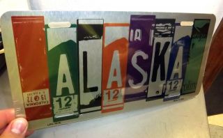Alaska Novelty Metal License Plate,  Printed To Look Like Strips Of Other Plates