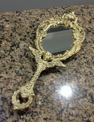 Vintage Ornate Brass Hand Vanity Mirror With Cherub