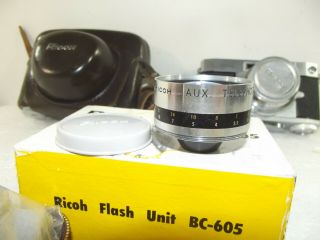 Ricoh 500 35mm Rangefinder Film Camera w/45mm f/2.  8 Lens,  acc.  tele lens,  flash 3