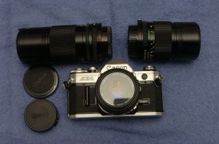 Canon Ae1 35mm Camera With 50mm,  135mm And 200mm Lens