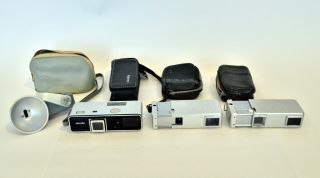 Three Minolta 16mm Cameras With Cases And Flash,  Read Entire Listing