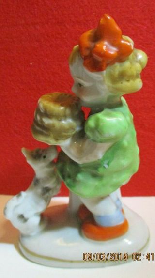 Vintage Little Figurine Girl In Green Carrying Chocolate Cake Dog Begging