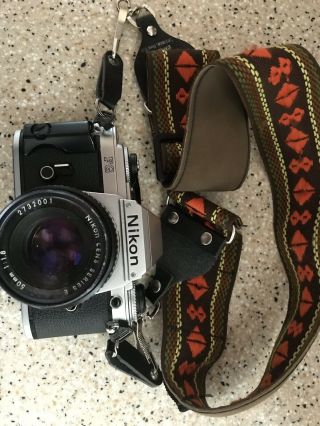 Vintage Nikon Fg 35 Mm Camera With Lens,  Filter And Hippy Strap.