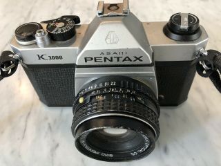 Pentax Film Camera Slr K1000 With 50mm Lens.  Missing Battery Door.