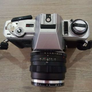 Minolta X - 300 With minolta auto rokkor PF f=58mm 1:1.  4 Lens 35mm film. 3