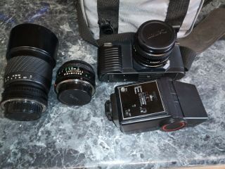 Canon T50 35mm Camera With 70 - 210 Zoom Lens,  50 Mm Lens,  And Albinar Flash