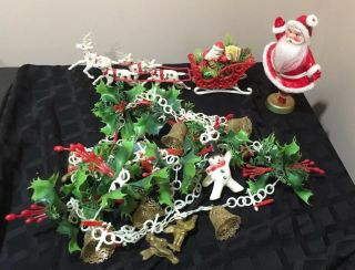 4 Vintage Plastic Christmas Decorations Santa Sleigh Reindeer Card Garland Holly