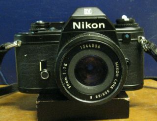 Nikon 35mm Camera Em With Series E 50mm 1:1.  8 Lens With Leather Case & Strap.
