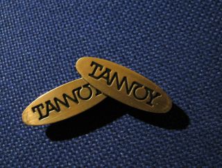 Tannoy 2 X Plastic Golden Logo Emblem Badges.  Size: 48mm X 15mm.