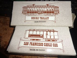 2 HO gauge trolley cars.  Desire street,  & Powell & Mason street cable car. 2