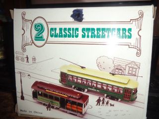 2 HO gauge trolley cars.  Desire street,  & Powell & Mason street cable car. 3