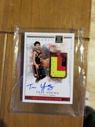 Trae Young Impeccable Elegance,  RC,  Auto,  Game Worn Jersey w 3 clrs,  Pack Fresh 3
